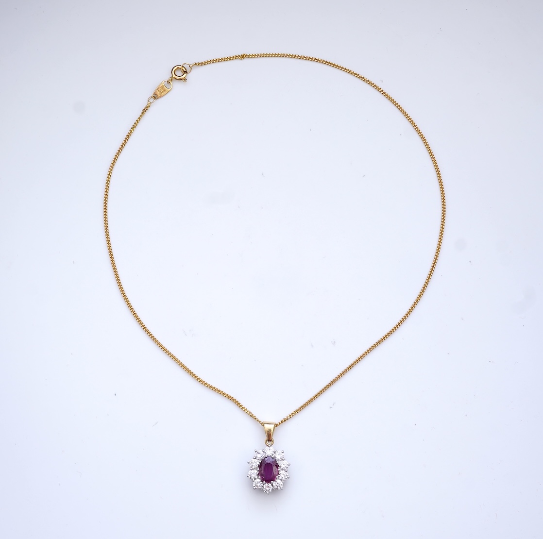 A ruby and diamond pendant